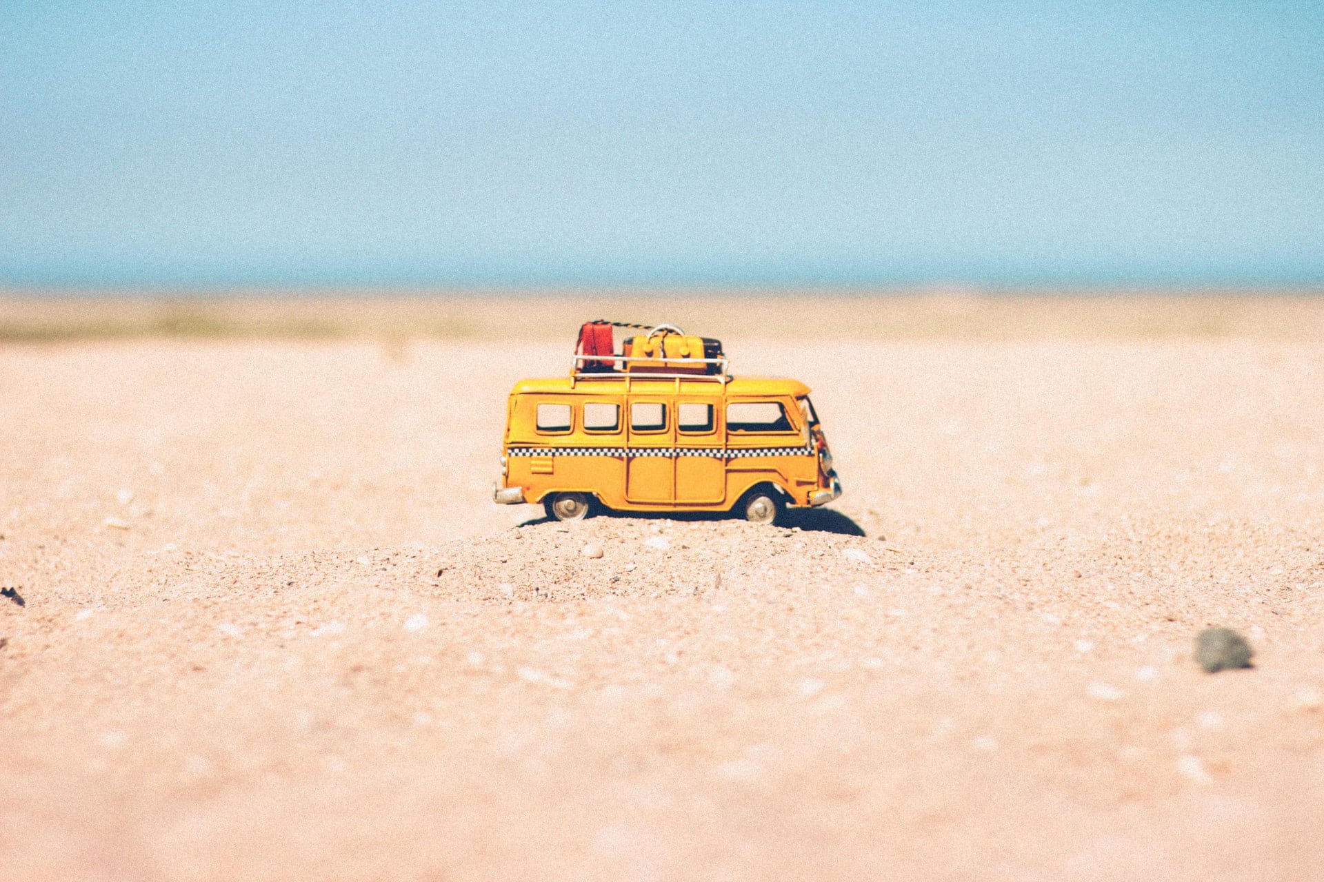 Photo of toy van on the sand